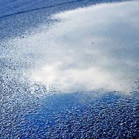 Pixwords Het beeld met water, asfalt, hemel, reflectie, weg Bellemedia - Dreamstime